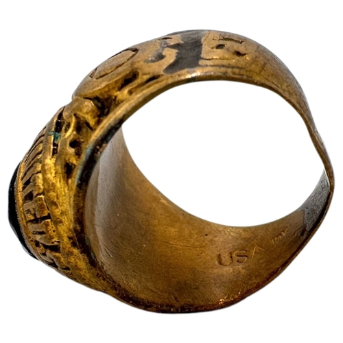 902 - A Vietnam war era US Coast Guard fraternity Ring, featuring a central dark blue oval stone and a sta... 