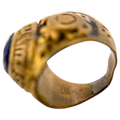 902 - A Vietnam war era US Coast Guard fraternity Ring, featuring a central dark blue oval stone and a sta... 