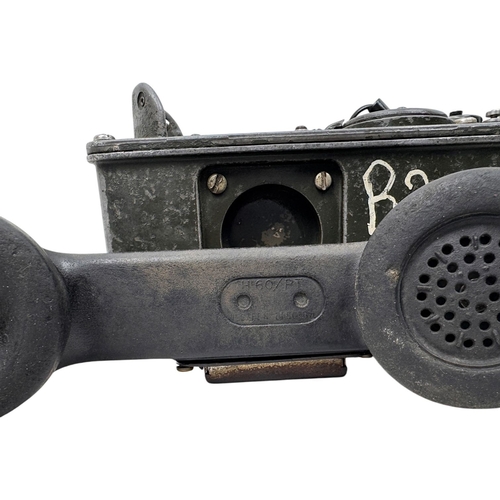 916 - A Vietnam war era US Army  H60/PT Military Field Telephone. Coiled cord connects the handset to the ... 