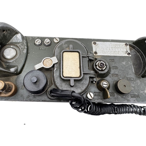 916 - A Vietnam war era US Army  H60/PT Military Field Telephone. Coiled cord connects the handset to the ... 