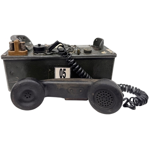 916 - A Vietnam war era US Army  H60/PT Military Field Telephone. Coiled cord connects the handset to the ... 