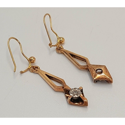 11 - A Pair of 9K Yellow Gold Diamond Drop Earrings. Art deco in style. 3cm drop. 3.5g total weight.