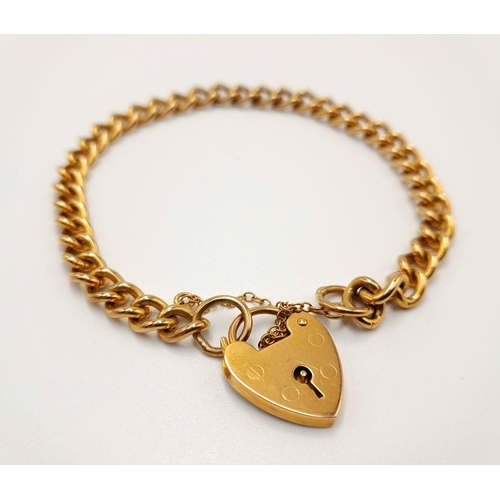 3 - A 9K Yellow Gold Curb Link Bracelet with Heart Clasp and Safety Chain. 17cm. 15.8g