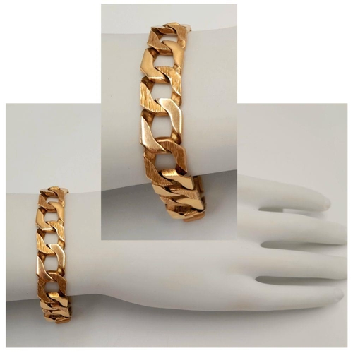 4 - A Chunky 9K Yellow Gold Curb Bracelet with Bark Effect Decoration. 18cm. 27g