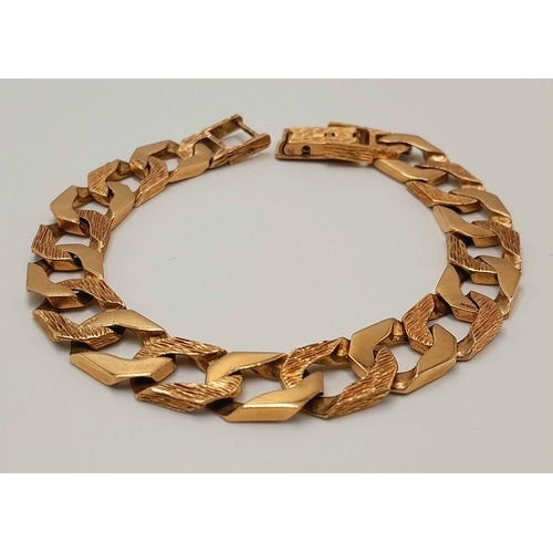 4 - A Chunky 9K Yellow Gold Curb Bracelet with Bark Effect Decoration. 18cm. 27g