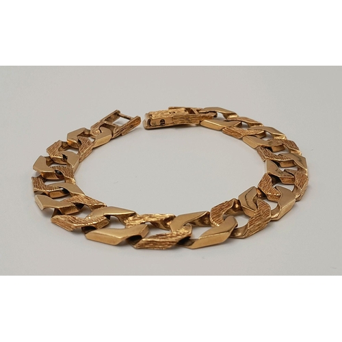 4 - A Chunky 9K Yellow Gold Curb Bracelet with Bark Effect Decoration. 18cm. 27g