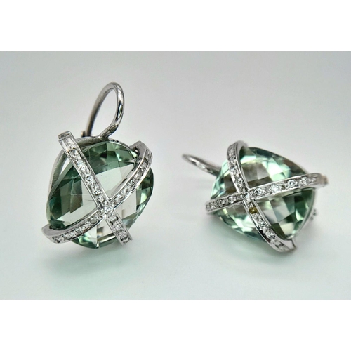 442 - A Pair of 18K Gold and Diamond Crossover Green Prasiolite Earrings. 8.4g total weight.