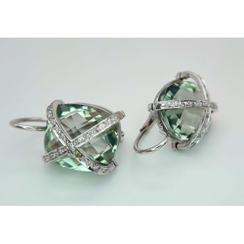 442 - A Pair of 18K Gold and Diamond Crossover Green Prasiolite Earrings. 8.4g total weight.