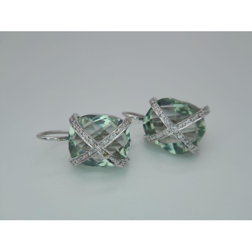 442 - A Pair of 18K Gold and Diamond Crossover Green Prasiolite Earrings. 8.4g total weight.