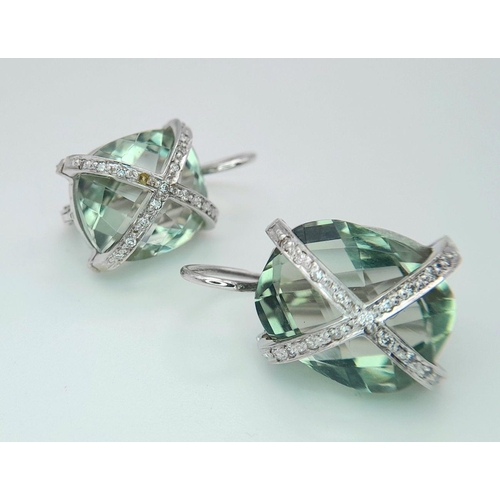 442 - A Pair of 18K Gold and Diamond Crossover Green Prasiolite Earrings. 8.4g total weight.