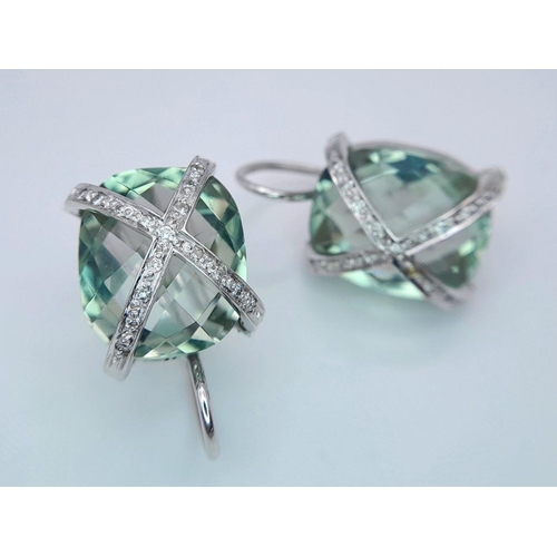 442 - A Pair of 18K Gold and Diamond Crossover Green Prasiolite Earrings. 8.4g total weight.