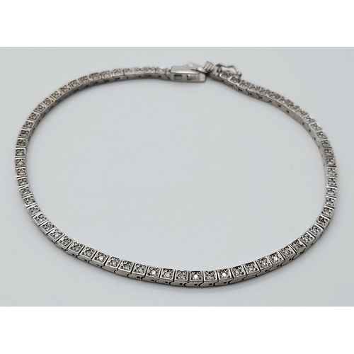 456 - A 14K White Gold Tennis Bracelet. 19cm. 8.6g total weight.