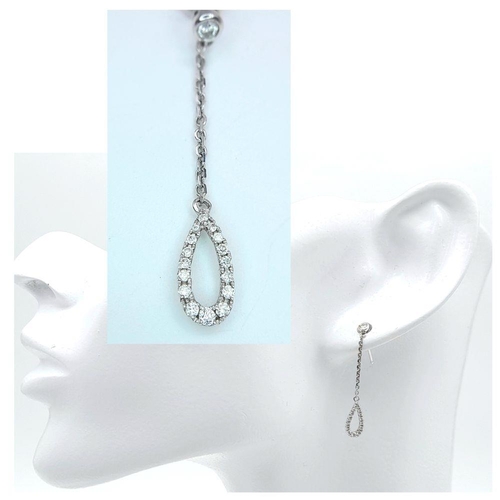 470 - A Pair of 18K White Gold, Diamond Drop Earrings. 3cm drop. 2g total weight.