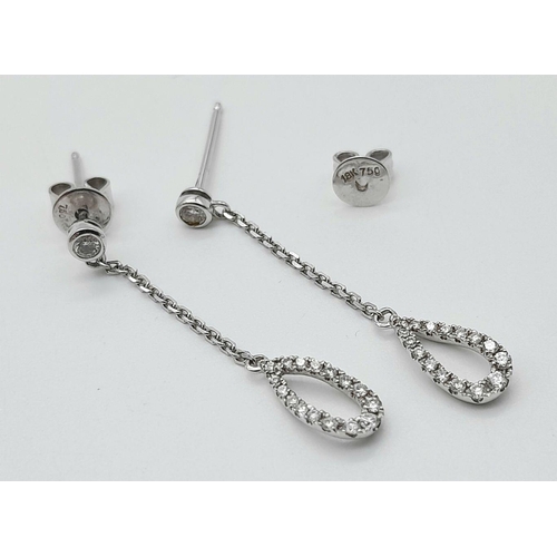 470 - A Pair of 18K White Gold, Diamond Drop Earrings. 3cm drop. 2g total weight.