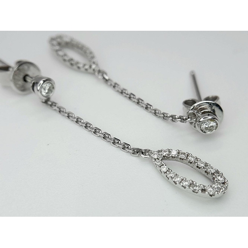 470 - A Pair of 18K White Gold, Diamond Drop Earrings. 3cm drop. 2g total weight.