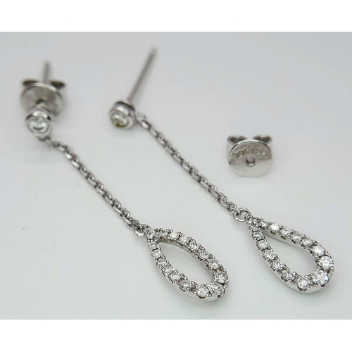 470 - A Pair of 18K White Gold, Diamond Drop Earrings. 3cm drop. 2g total weight.