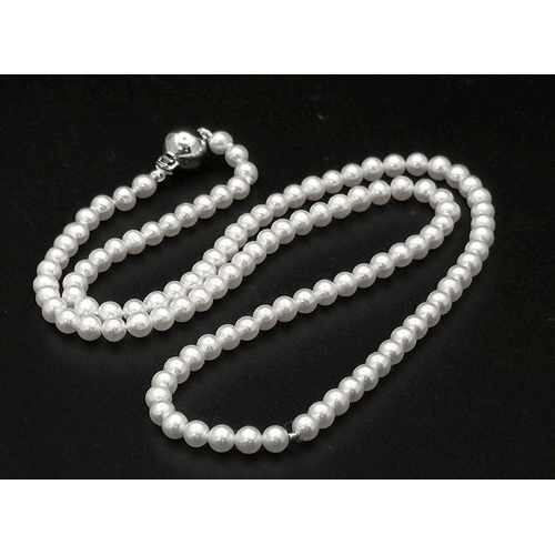 477 - A Cultured Pearl Bead Necklace with an 18K White Gold Clasp. Pearls 3/4mm. 40cm length. 8.2g total w... 