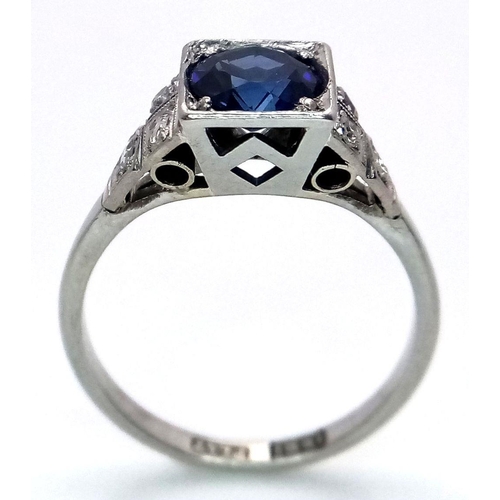 57 - An Art Deco 18K White Gold and Platinum, Sapphire and Diamond Ring. A mesmerising 1.5ct sapphire wit... 