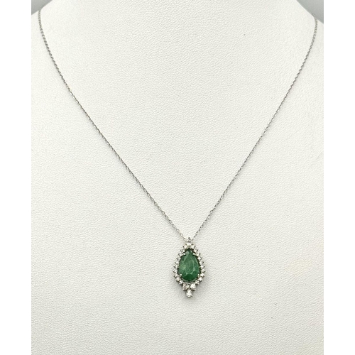 722 - A 9K Gold, Emerald and Diamond Pendant on a 9K Gold Disappearing Necklace. 2cm and 44cm. 2.5g total ... 