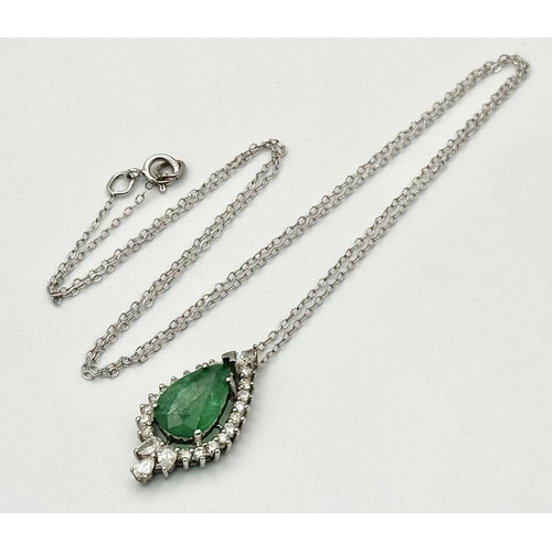 722 - A 9K Gold, Emerald and Diamond Pendant on a 9K Gold Disappearing Necklace. 2cm and 44cm. 2.5g total ... 