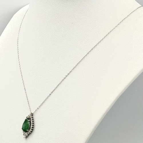 722 - A 9K Gold, Emerald and Diamond Pendant on a 9K Gold Disappearing Necklace. 2cm and 44cm. 2.5g total ... 