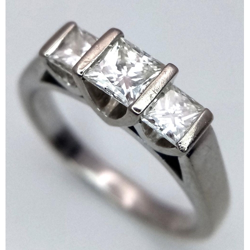 85 - An 18K White Gold Three Stone Diamond Ring. 0.80ctw of Princess cut diamonds - SI1 clarity. Size L. ... 