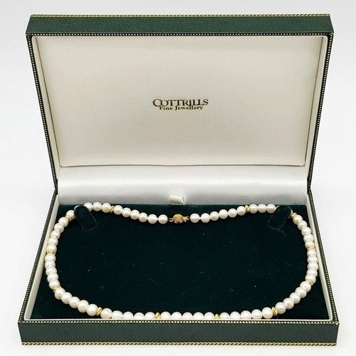 542 - A 9K Gold and Freshwater Pearl Necklace. 40cm. Gold clasp and spacers. Pearls 6/7mm. 18g. Comes with... 