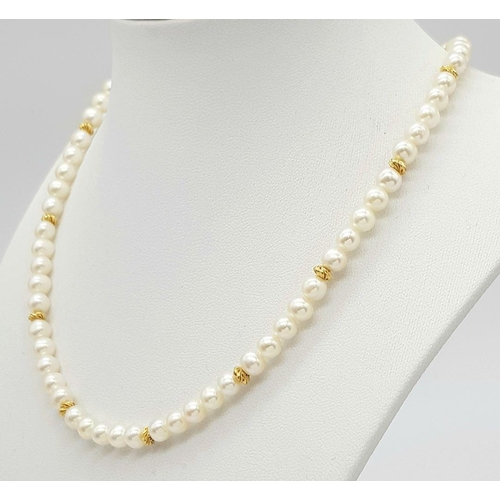 542 - A 9K Gold and Freshwater Pearl Necklace. 40cm. Gold clasp and spacers. Pearls 6/7mm. 18g. Comes with... 