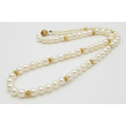 542 - A 9K Gold and Freshwater Pearl Necklace. 40cm. Gold clasp and spacers. Pearls 6/7mm. 18g. Comes with... 