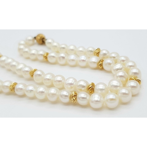 542 - A 9K Gold and Freshwater Pearl Necklace. 40cm. Gold clasp and spacers. Pearls 6/7mm. 18g. Comes with... 