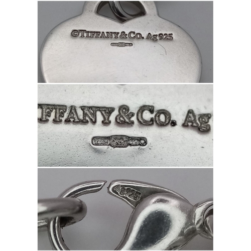 956 - A Tiffany and Co. Sterling Silver Heart Bracelet. 16cm. 32.5g. Comes with Tiffany pouch and box.