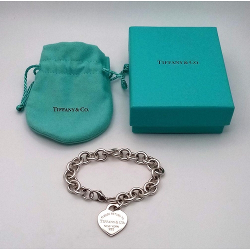 956 - A Tiffany and Co. Sterling Silver Heart Bracelet. 16cm. 32.5g. Comes with Tiffany pouch and box.