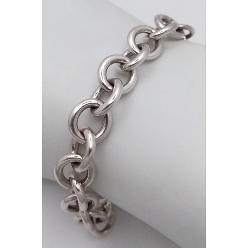 956 - A Tiffany and Co. Sterling Silver Heart Bracelet. 16cm. 32.5g. Comes with Tiffany pouch and box.