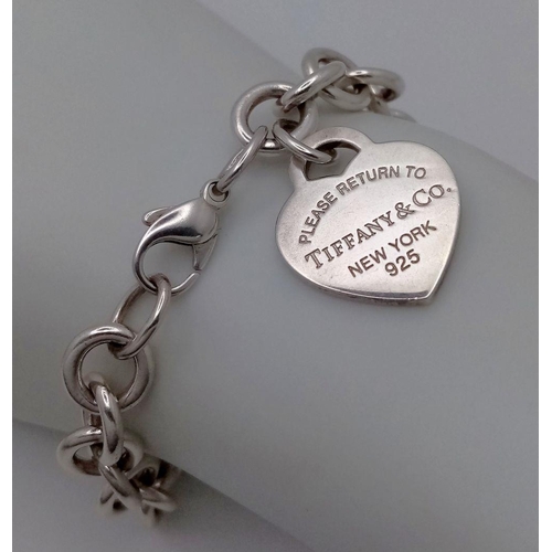 956 - A Tiffany and Co. Sterling Silver Heart Bracelet. 16cm. 32.5g. Comes with Tiffany pouch and box.