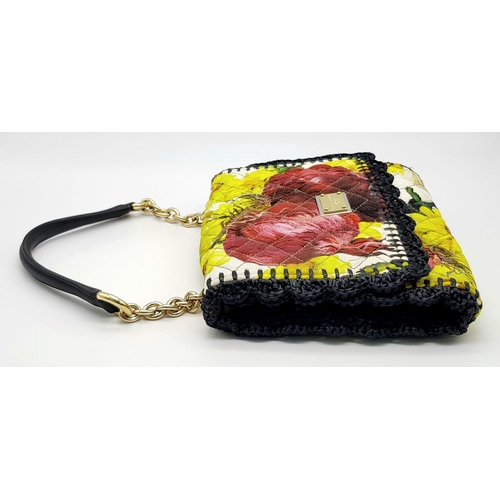 570 - A Dolce & Gabbana Quilted Printed Shoulder Bag. Multicoloured quilted fabric exterior features a vib... 