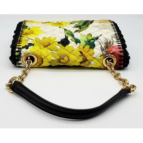 570 - A Dolce & Gabbana Quilted Printed Shoulder Bag. Multicoloured quilted fabric exterior features a vib... 