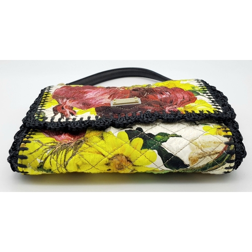 570 - A Dolce & Gabbana Quilted Printed Shoulder Bag. Multicoloured quilted fabric exterior features a vib... 