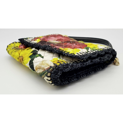 570 - A Dolce & Gabbana Quilted Printed Shoulder Bag. Multicoloured quilted fabric exterior features a vib... 