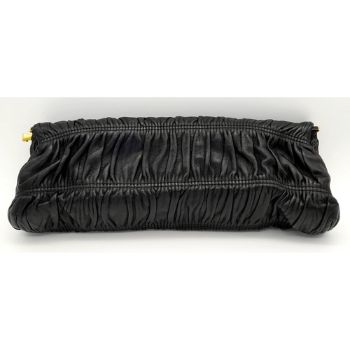 577 - A Prada Black Gathered Leather Clutch Bag. Black leather exterior with ruched detailing, gold-toned ... 