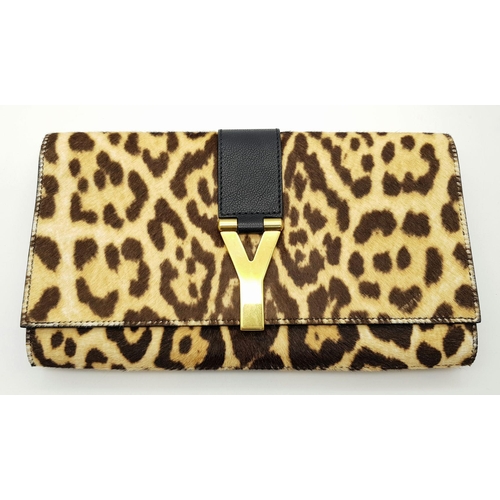 675 - A Saint Laurent Leopard Print Haircalf Cassandre Clutch. Leopard print haircalf exterior with gold-t... 