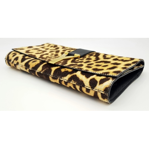 675 - A Saint Laurent Leopard Print Haircalf Cassandre Clutch. Leopard print haircalf exterior with gold-t... 