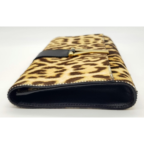 675 - A Saint Laurent Leopard Print Haircalf Cassandre Clutch. Leopard print haircalf exterior with gold-t... 