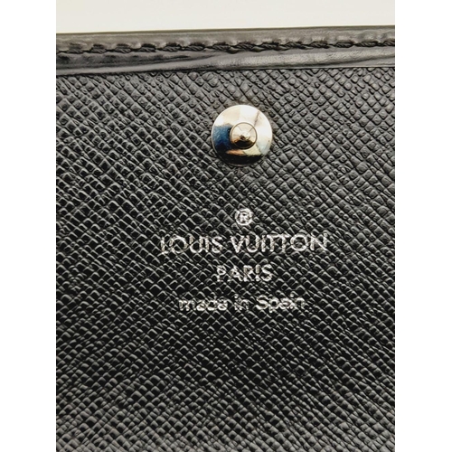 241 - A Louis Vuitton Black Epi Leather Sarah Wallet. Black Epi leather exterior with silver-toned hardwar... 