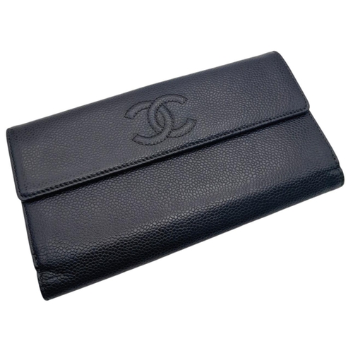 984 - A Chanel Black Caviar Timeless CC Long Wallet. Black caviar leather exterior with silver-toned hardw... 