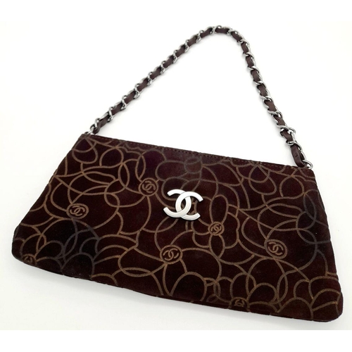 991 - A Chanel Brown Suede Camellia Clutch Bag. Brown suede exterior with Camellia floral motif detailing ... 