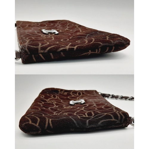 991 - A Chanel Brown Suede Camellia Clutch Bag. Brown suede exterior with Camellia floral motif detailing ... 