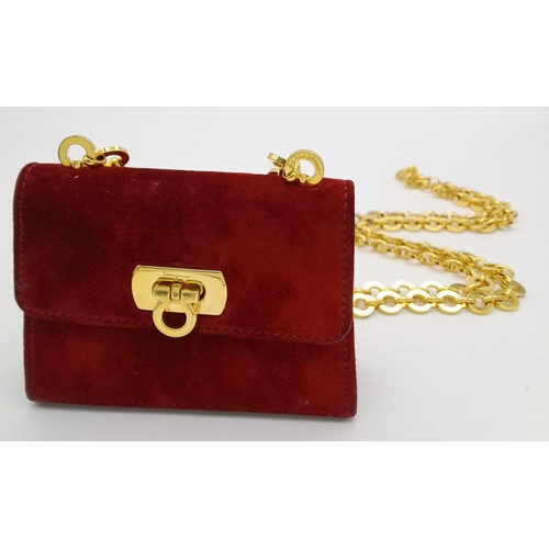 998 - A Salvatore Ferragamo Bordeaux Red Suede Mini Bag. Bordeaux Red suede exterior with gold-toned hardw... 