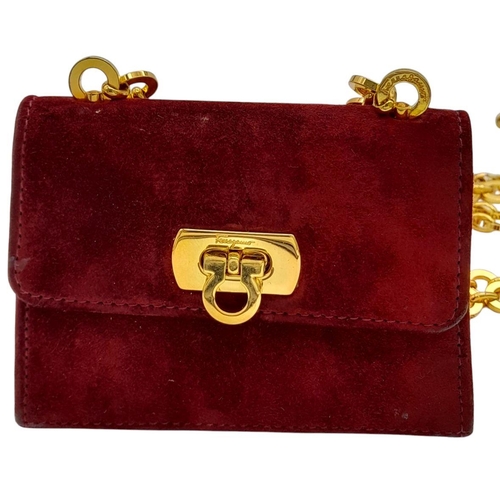 998 - A Salvatore Ferragamo Bordeaux Red Suede Mini Bag. Bordeaux Red suede exterior with gold-toned hardw... 