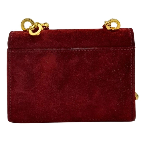 998 - A Salvatore Ferragamo Bordeaux Red Suede Mini Bag. Bordeaux Red suede exterior with gold-toned hardw... 