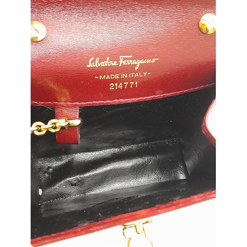 998 - A Salvatore Ferragamo Bordeaux Red Suede Mini Bag. Bordeaux Red suede exterior with gold-toned hardw... 